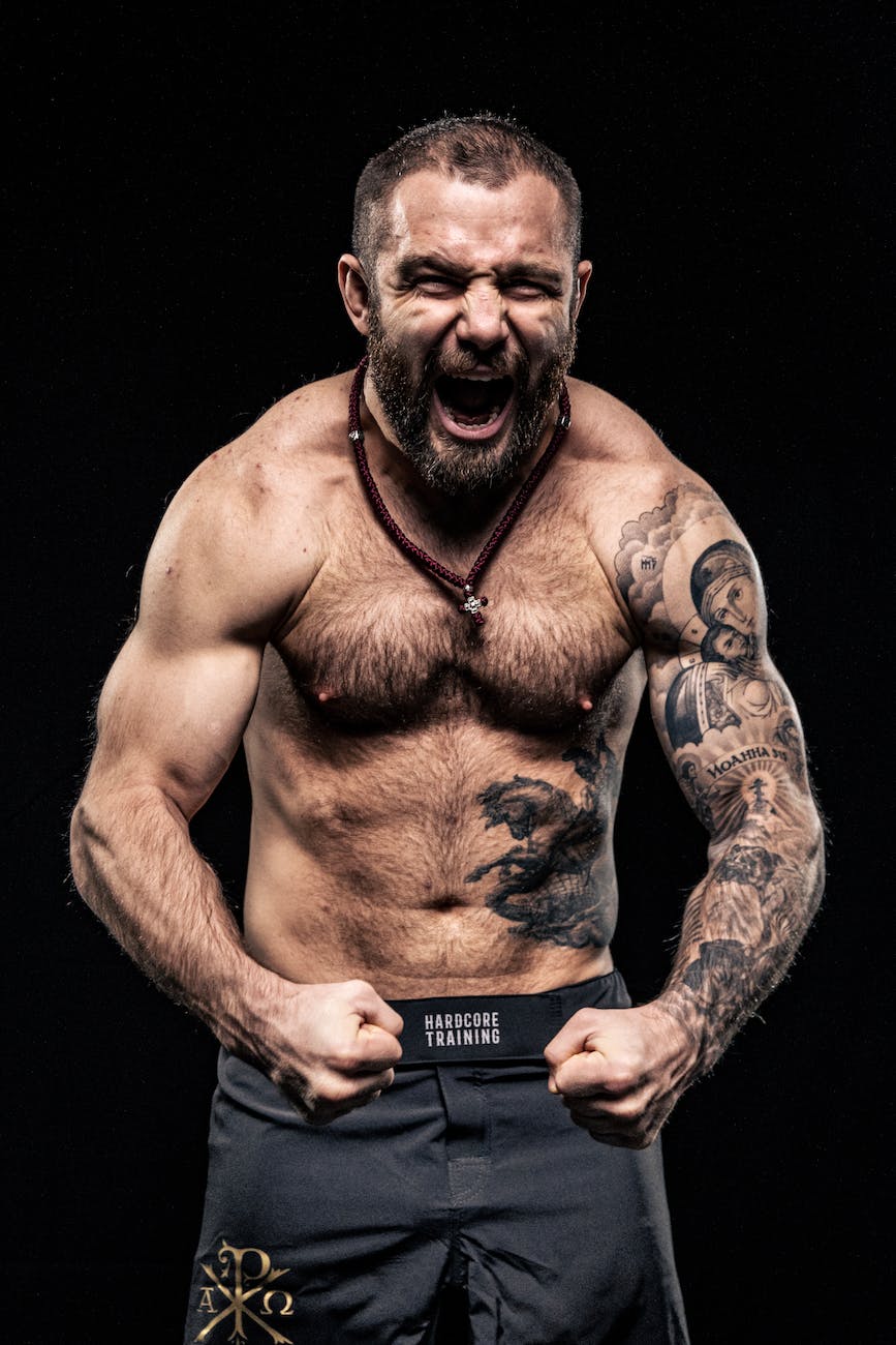 shouting shirtless bodybuilder with tattoos