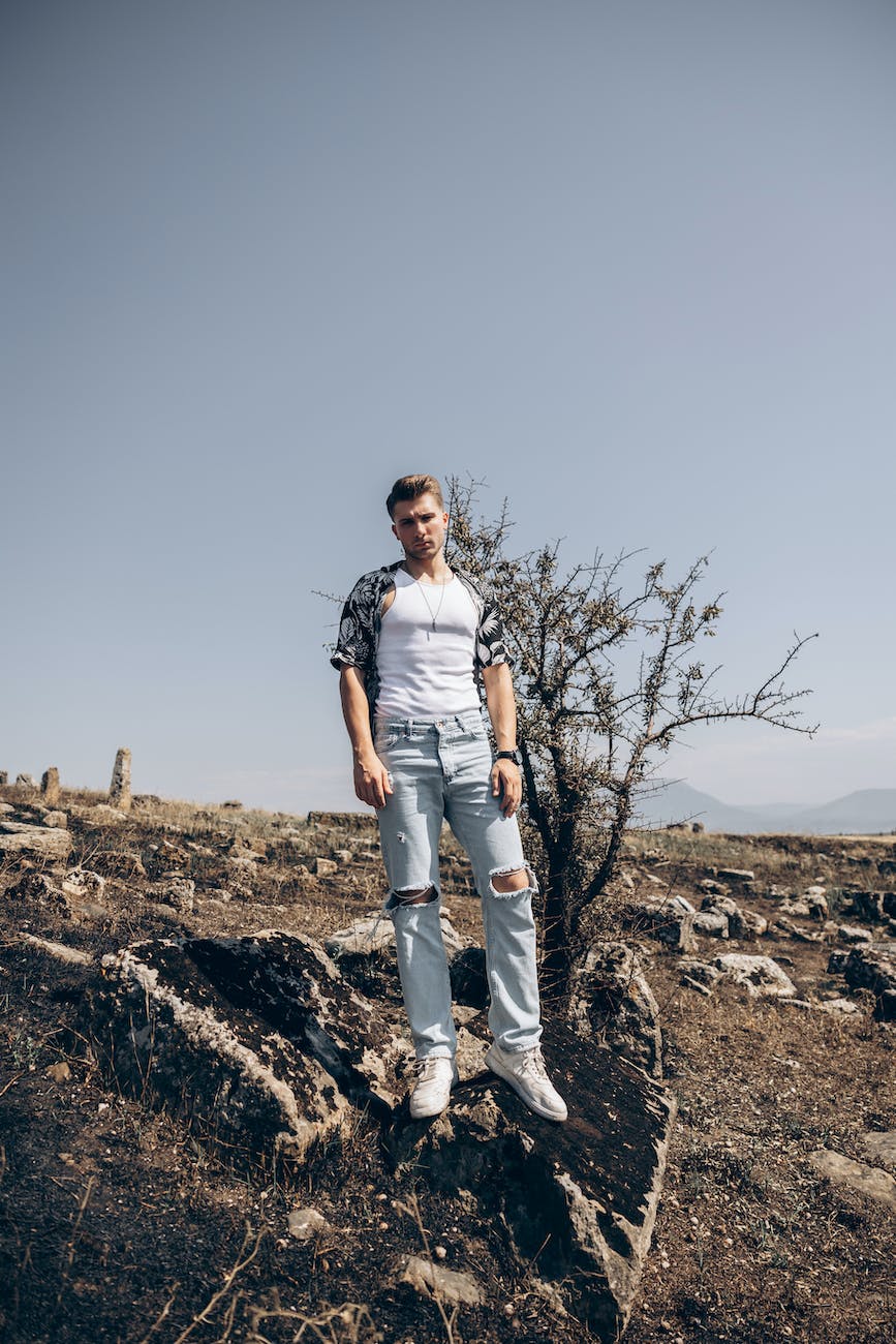 man posing in arid countryside
