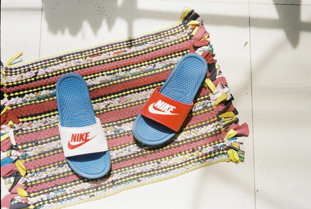 nike sandals on rug