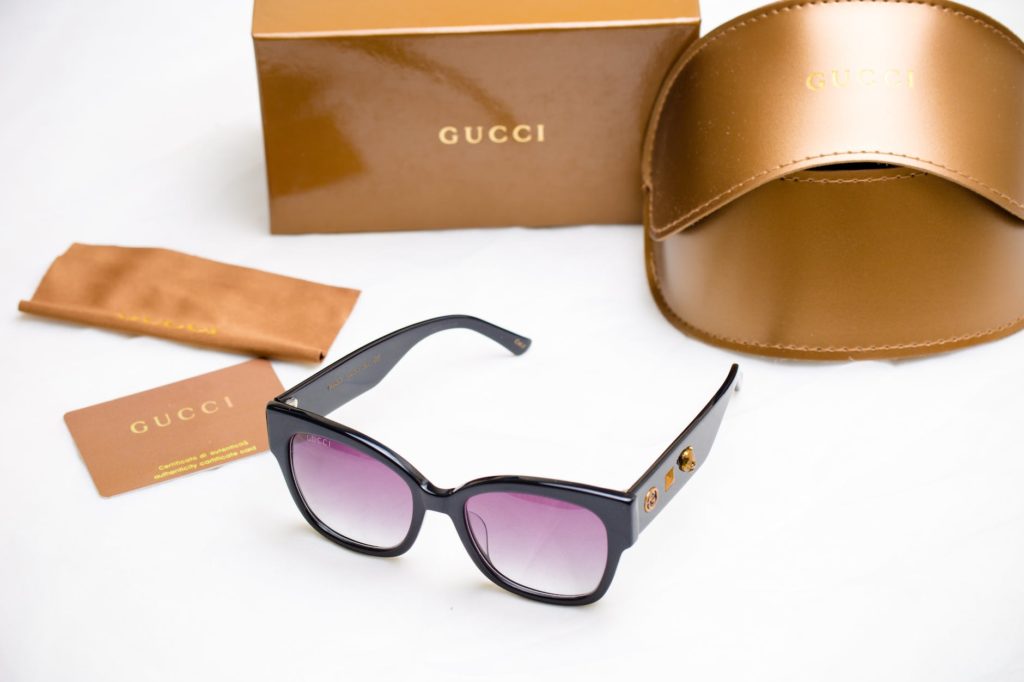 gucci purple sunglasses and bronze leather case