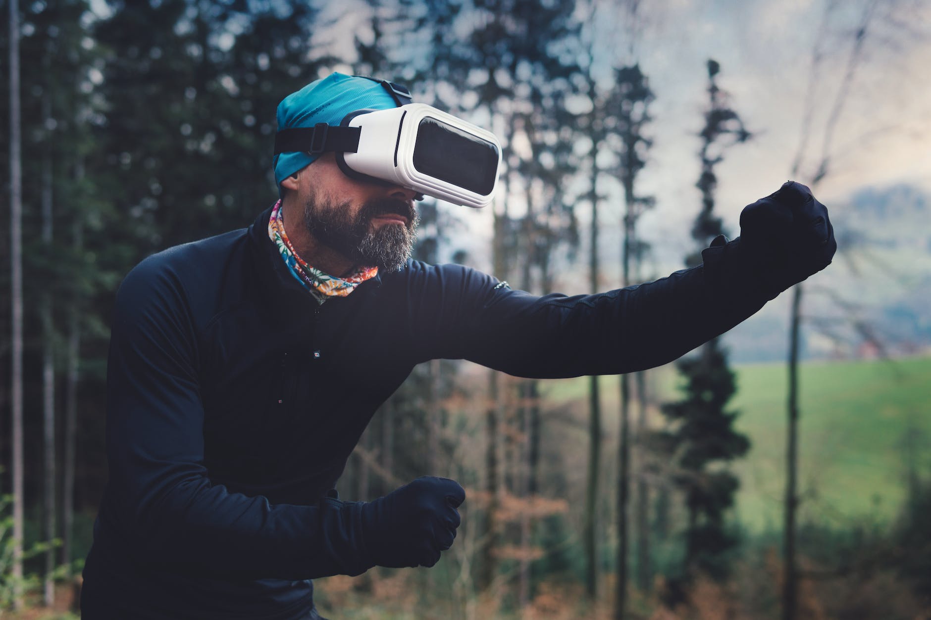 person wearing black henley shirt and white vr goggles