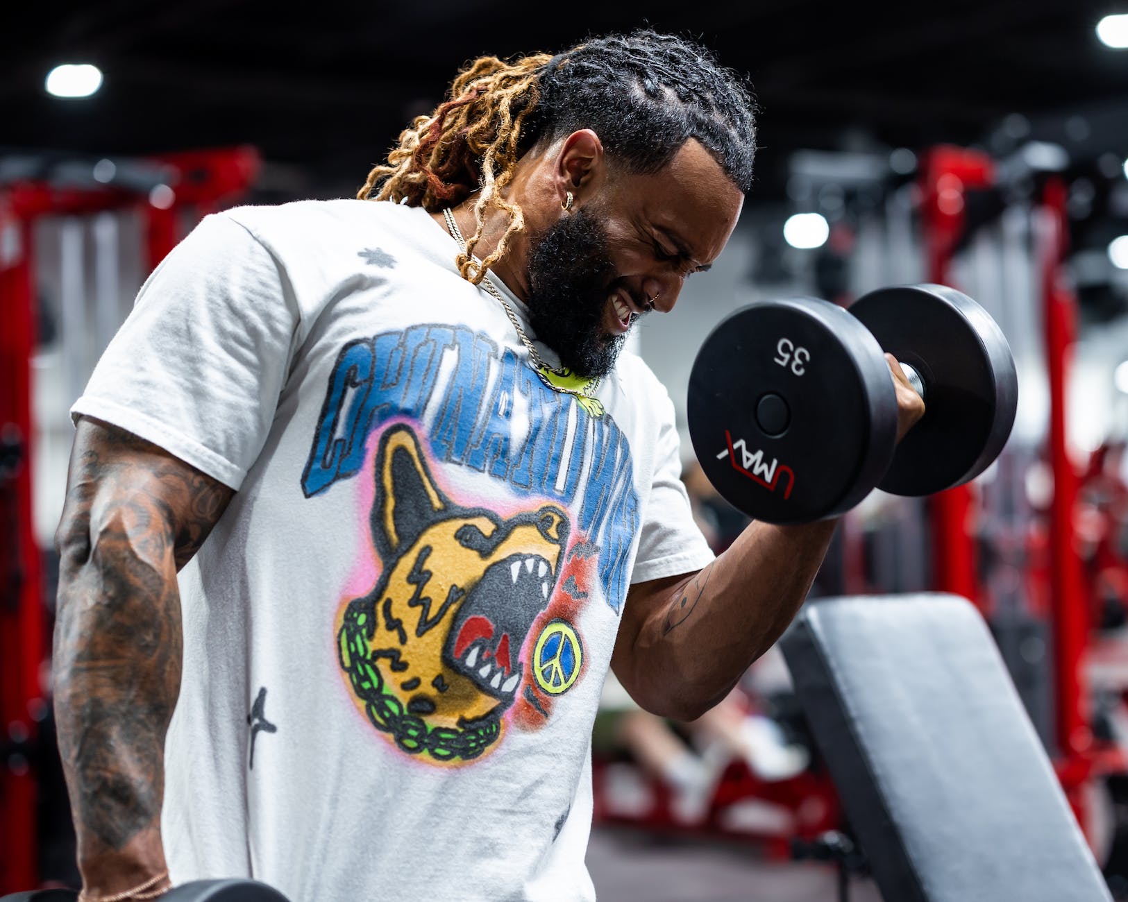 man in t shirt practicing at gym