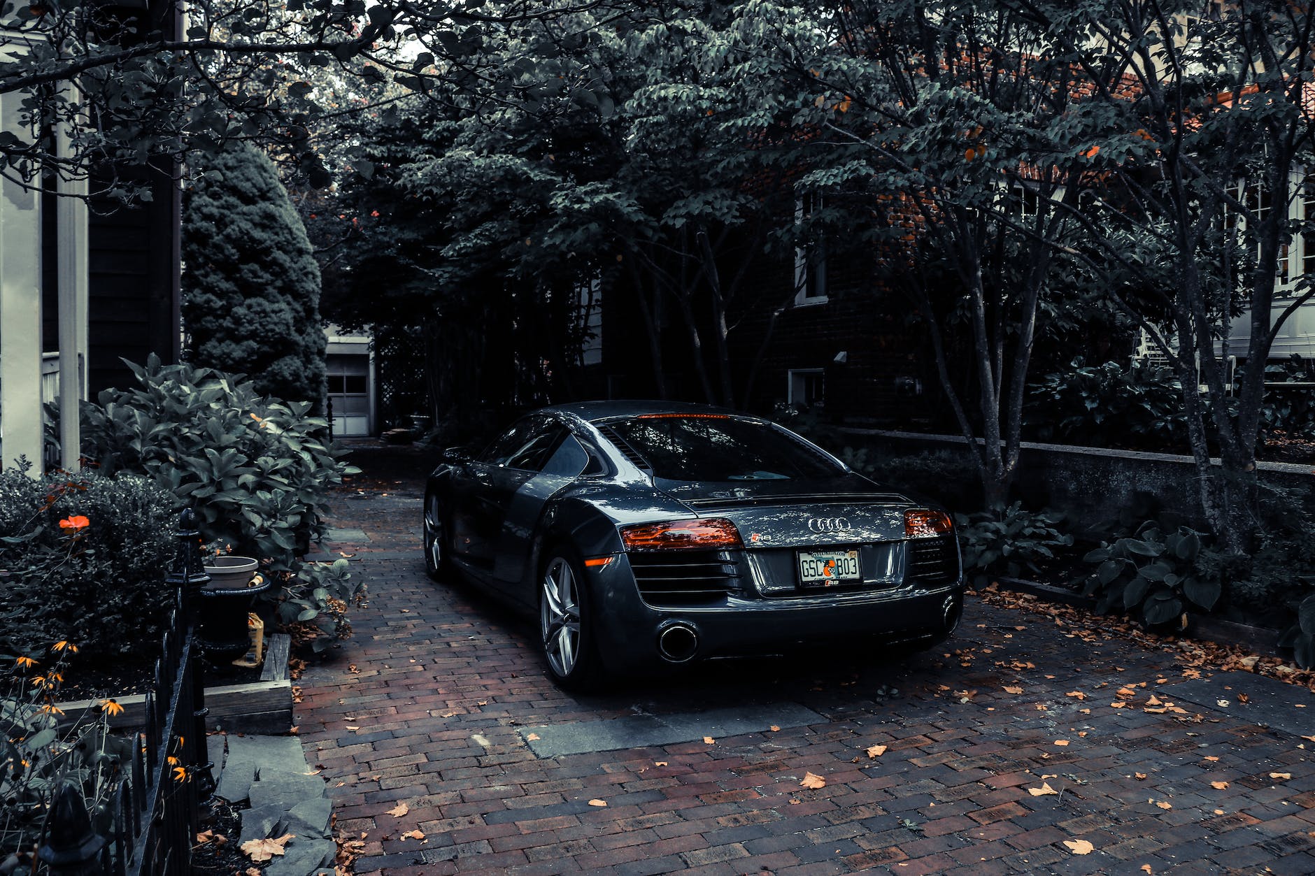 photo of audi parked near trees