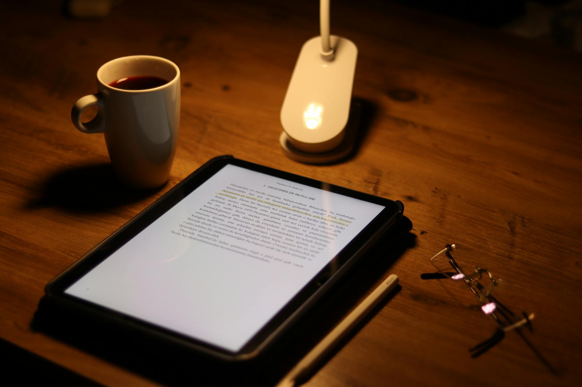 tablet with document and coffee cup in cozy setting